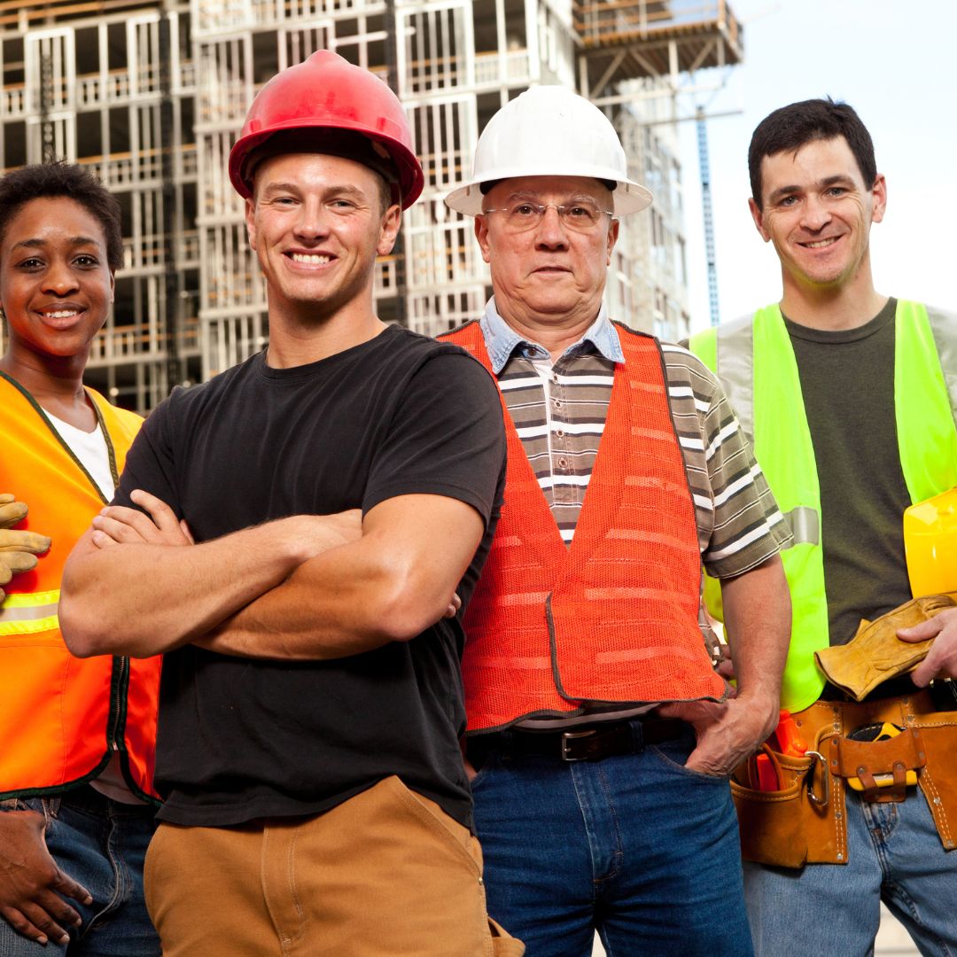 four construction workers standing together