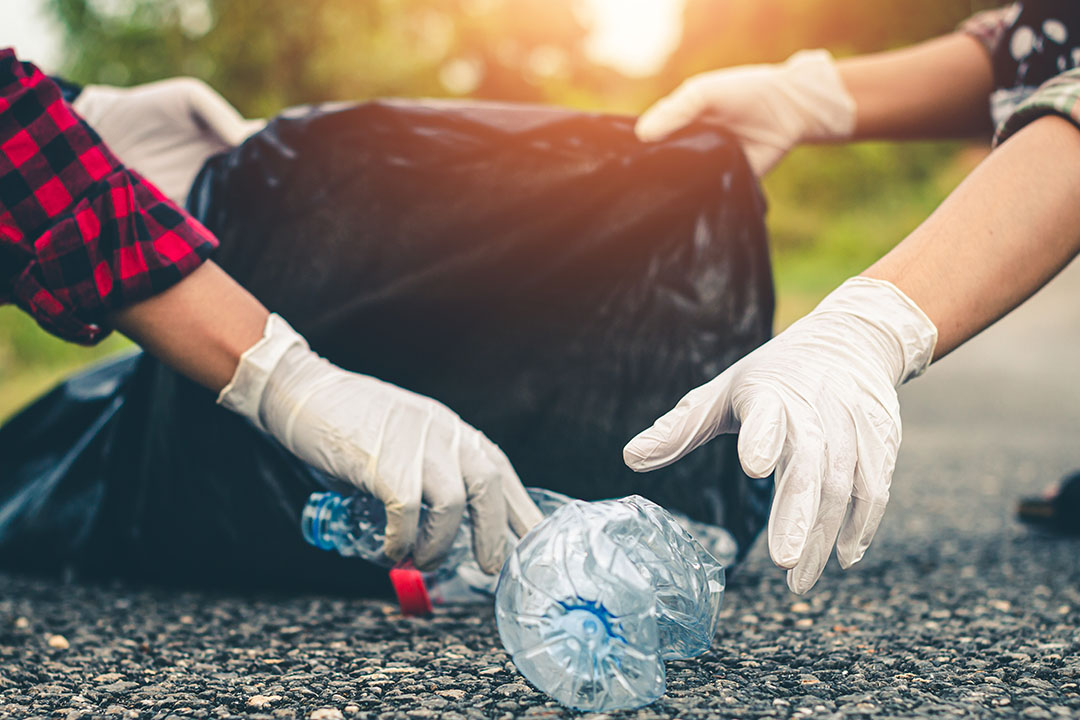 Women volunteer help garbage collection for to recycling environment.
